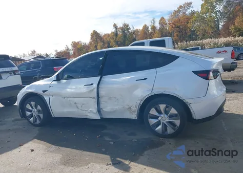 2023 Tesla Model Y Awd/Long Range Dual Motor All-Wheel Drive z USA, uszkodzony, nr VIN 7SAYGDEE8PA099530